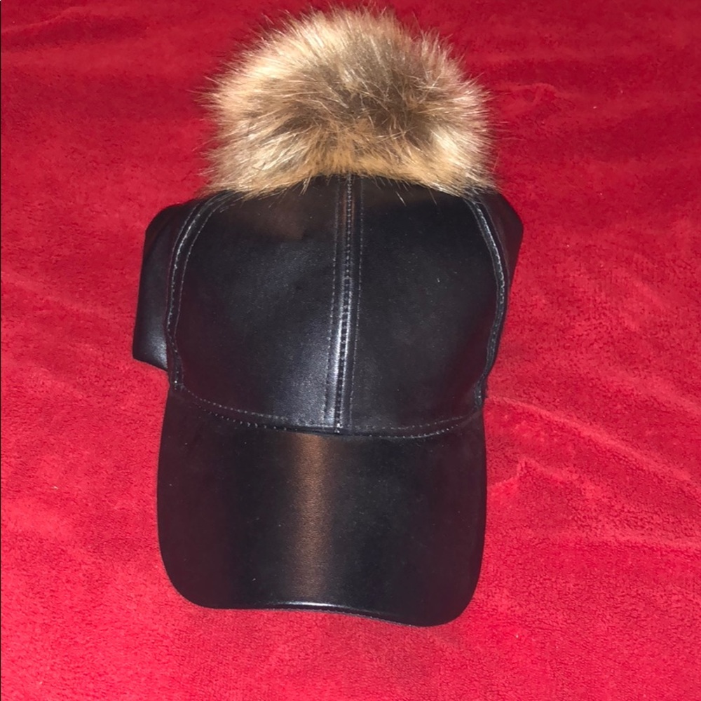 Black hat with puff ball
